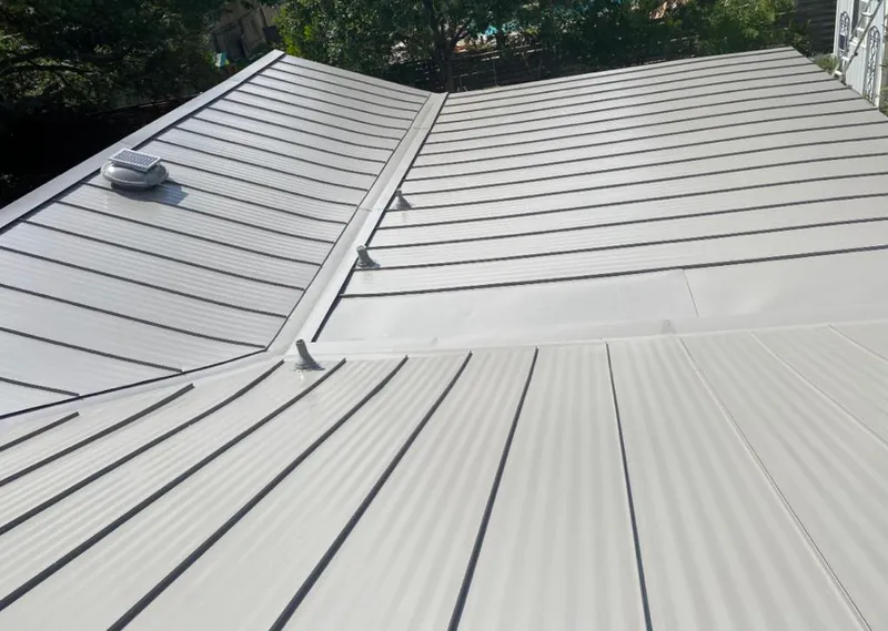 Solar attic fan installed on a metal roof for Roof Ventilation in Leisure City